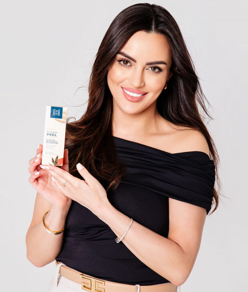 Monika, COSKOR founder, holding Eraser Enzyme Peel